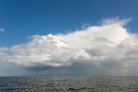 Beautiful white clouds over the river bankの写真素材