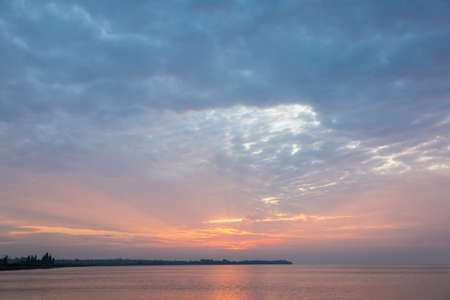 Dramatic sunrise over the river. Orange sunriseの写真素材