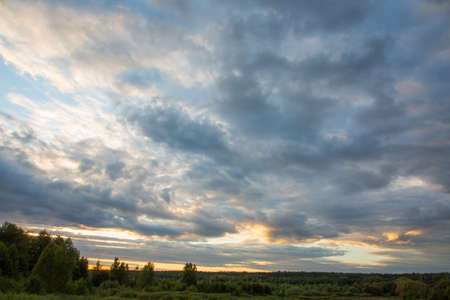 Large clouds in cloudy weather at sunsetの写真素材