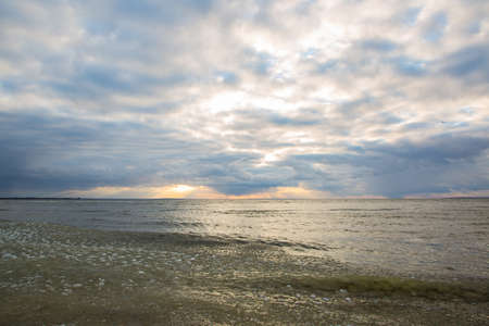 Sunset near the river bank in cold winterの写真素材