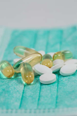Useful different vitamins and protective medical maskの写真素材