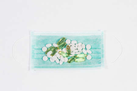 Useful different vitamins and protective medical maskの写真素材
