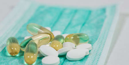 Useful different vitamins and protective medical maskの写真素材