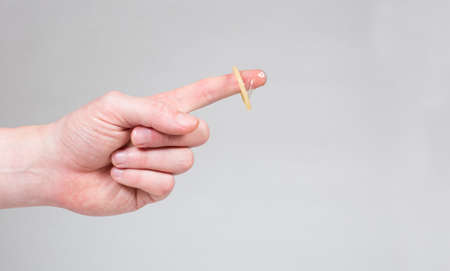 Safe sex condom in man's hand, contraceptiveの写真素材