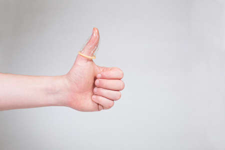 Safe sex condom in man's hand, contraceptiveの写真素材