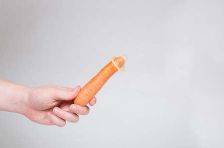 Safe sex condom in man's hand, contraceptiveの写真素材