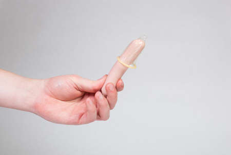 Condom in man's hand, contraception, health safety, safe loveの写真素材