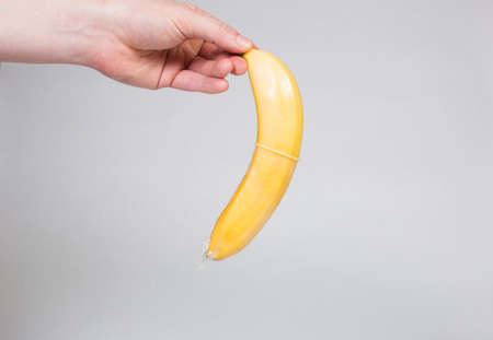 Condom in man's hand, contraception, health safety, safe loveの写真素材