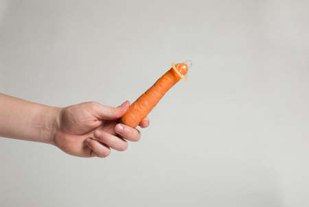 Condom in man's hand, contraception, health safety, safe loveの写真素材