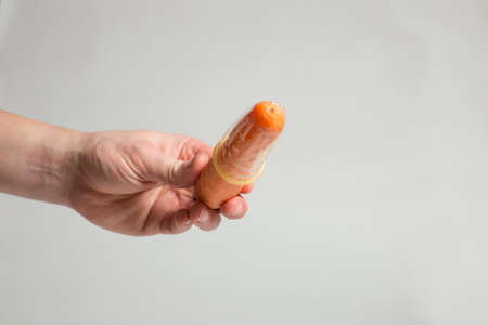 Condom in man's hand, contraception, health safety, safe loveの写真素材