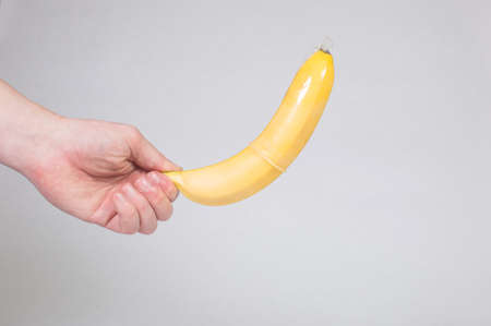 Condom in man's hand, contraception, health safety, safe loveの写真素材