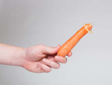 Condom in man's hand, contraception, health safety, safe loveの写真素材