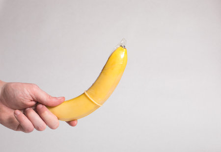 Condom in man's hand, contraception, health safety, safe loveの写真素材