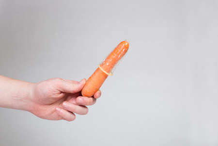 Condom in man's hand, contraception, health safety, safe loveの写真素材