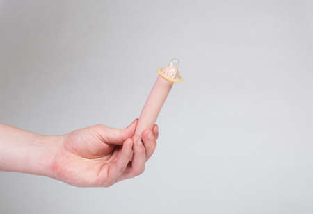 Condom in man's hand, contraception, health safety, safe loveの写真素材