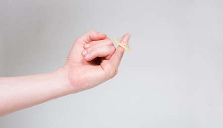 Condom in man's hand, contraception, health safety, safe loveの写真素材