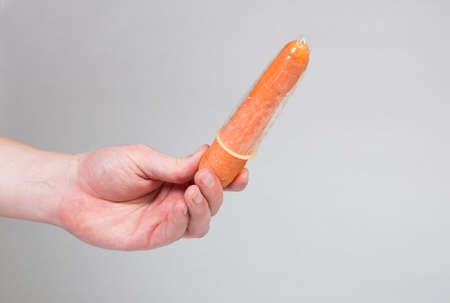 Condom in man's hand, contraception, health safety, safe loveの写真素材