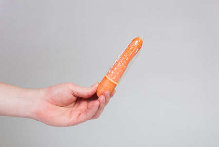 Condom in man's hand, contraception, health safety, safe loveの写真素材