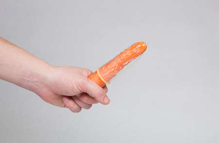 Condom in man's hand, contraception, health safety, safe loveの写真素材