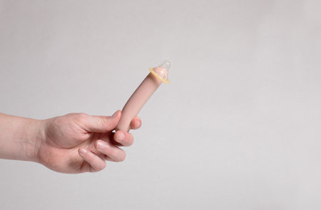 Condom in man's hand, contraception, health safety, safe loveの写真素材