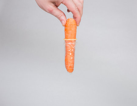 Condom in man's hand, contraception, health safety, safe loveの写真素材