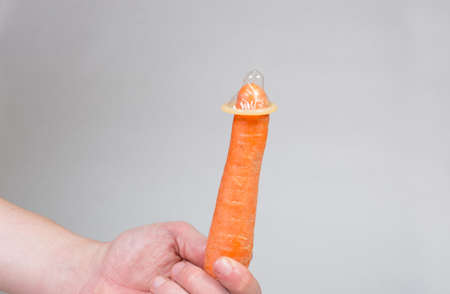 Condom in man's hand, contraception, health safety, safe loveの写真素材