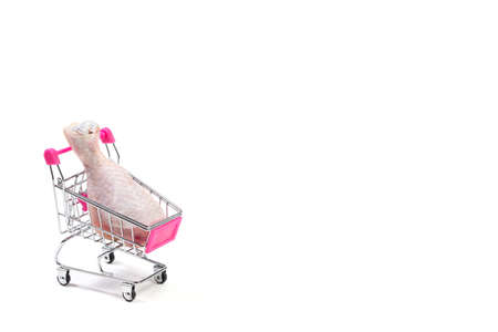 Fresh chicken meat in shopping cart isolated on white backgroundの写真素材