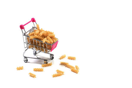 Pasta in a shopping basket on a white backgroundの写真素材