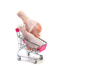 Fresh chicken meat in shopping cart isolated on white backgroundの写真素材