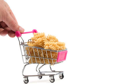 Pasta in a shopping basket on a white backgroundの写真素材