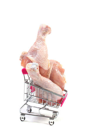 Fresh chicken meat in shopping cart isolated on white backgroundの写真素材
