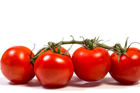 Red cherry tomatoes for salad on white backgroundの写真素材