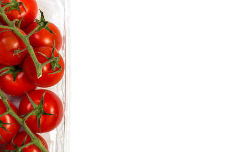Red cherry tomatoes for salad on white backgroundの写真素材