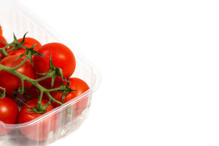 Red cherry tomatoes for salad on white backgroundの写真素材