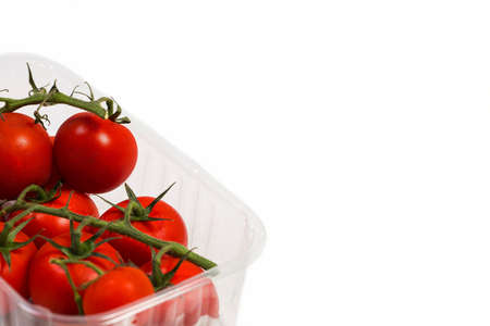 Red cherry tomatoes for salad on white backgroundの写真素材