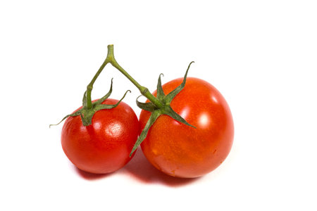 Red cherry tomatoes for salad on white backgroundの写真素材