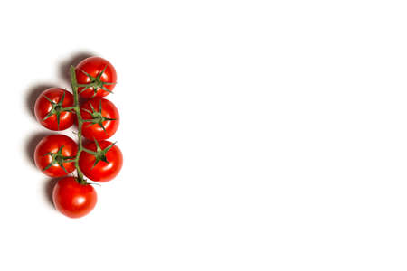 Red cherry tomatoes for salad on white backgroundの写真素材