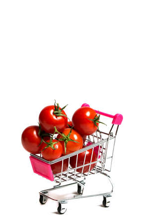 Cherry tomatoes and shopping cart on white backgroundの写真素材