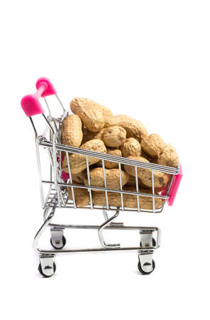 Peanuts in a shell in a shopping cart on a white background, healthy foodの写真素材
