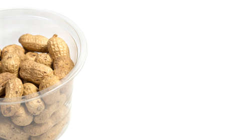 Peanuts in shell on white background, healthy foodの写真素材