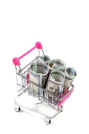Small shopping cart with dollars, money in shopping cart, shoppingの写真素材