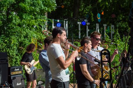 The rock concert was held in Odessa City, Ukraine, open-air theater called Green Theater.  On stage are musical bands, singers and musicians.  Musical instruments.のeditorial素材