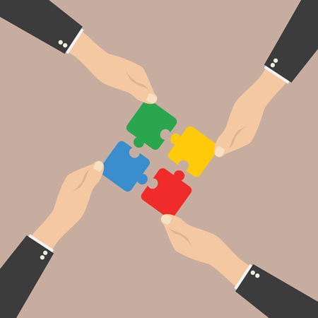 Hands putting puzzle pieces together. Teamwork concept. Flat designのイラスト素材