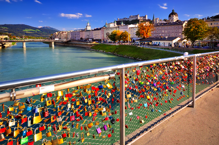 lock of love on the bridge in Salzburgの写真素材