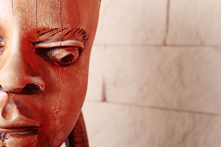 Ancient wooden sculpture from Africa. A head of the woman.の写真素材