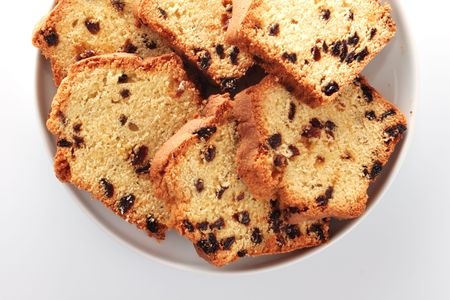 fruitcake on a white plateの写真素材