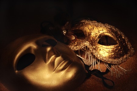  golden venetian masks on a textileの写真素材