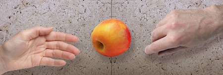 woman and men hands with appleの写真素材