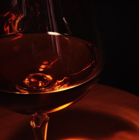 brandy in glass,focus on a foregroundの写真素材