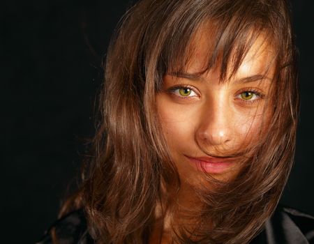beautiful girl in black with long hairの写真素材